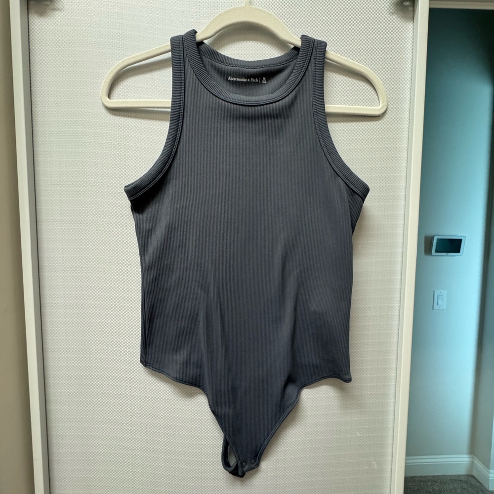 Abercrombie bodysuit size medium. Color is a grey hint of blue. Never worn.